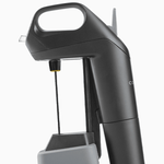 Coravin wine preservation tool featuring a sleek black design and a needle for pouring without removing the cork.