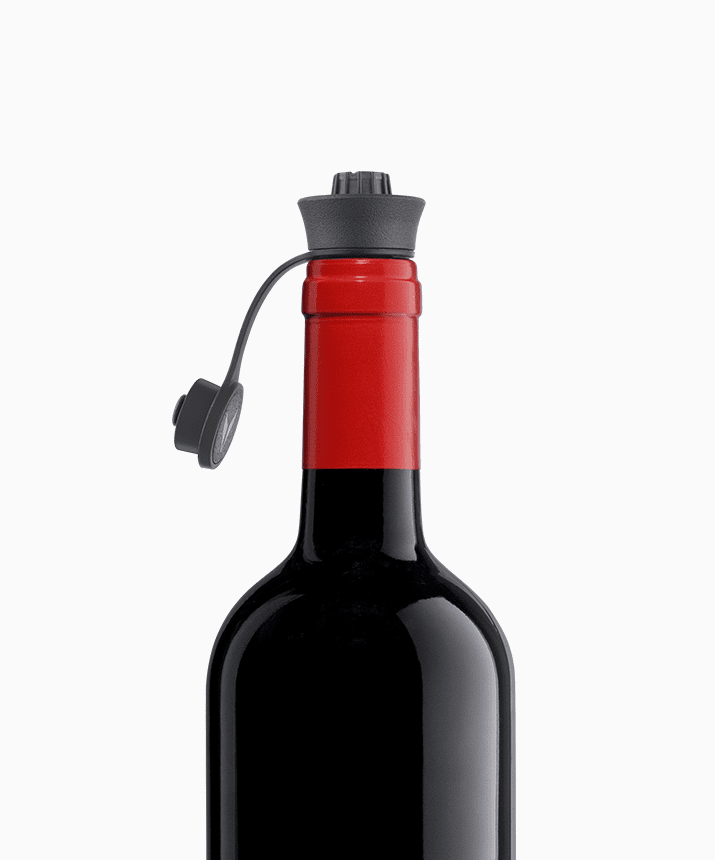 Red wine bottle with a black screw cap and attached plastic tether.