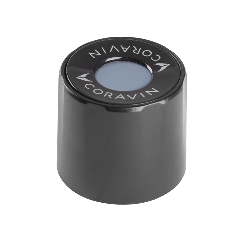 Black Coravin wine stopper with a circular top featuring a blue center and the Coravin logo.